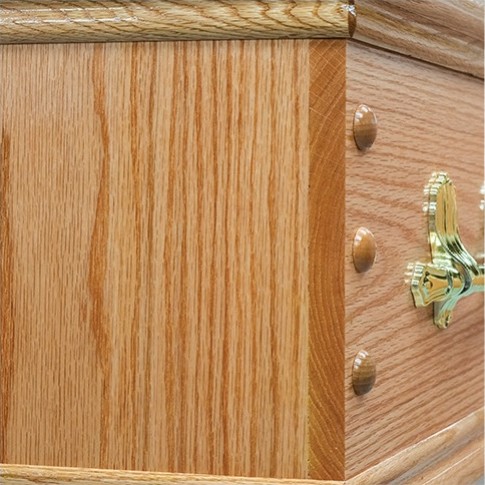 The butt end and solid oak double mouldings of The Derby, with a brass handle bracket at the corner