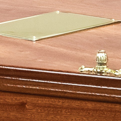 Blank brass nameplate and a brass lid fitting on the lid of The Milldale, ready for engraving
